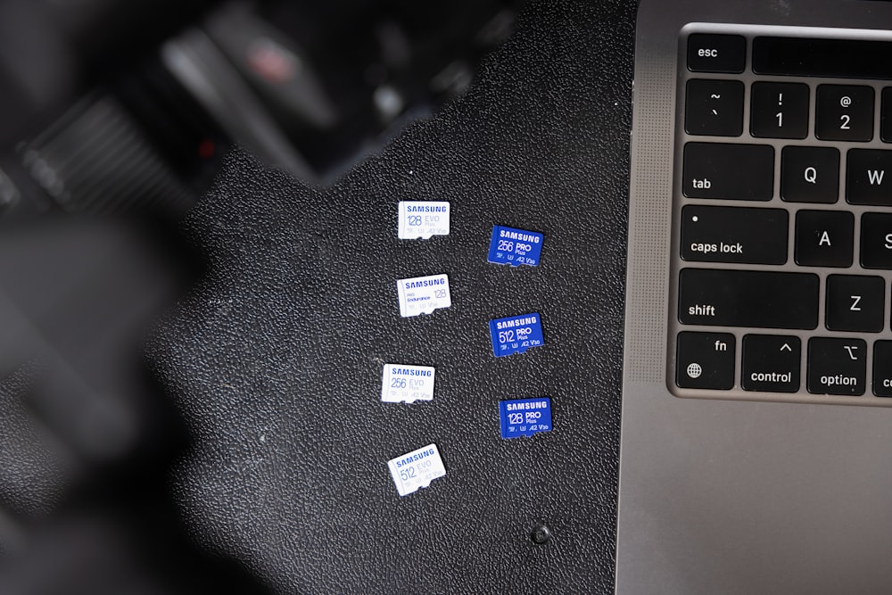 a black keyboard and a black laptop