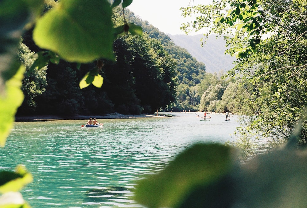 a group of people on a boat in a lake