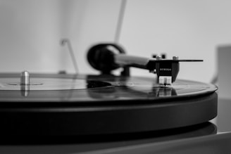 Close-up photo of a vinyl record spinning on a turntable.