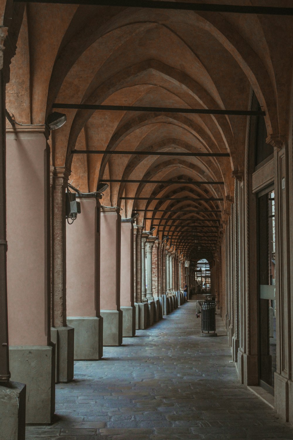 a walkway with a large arched ceiling