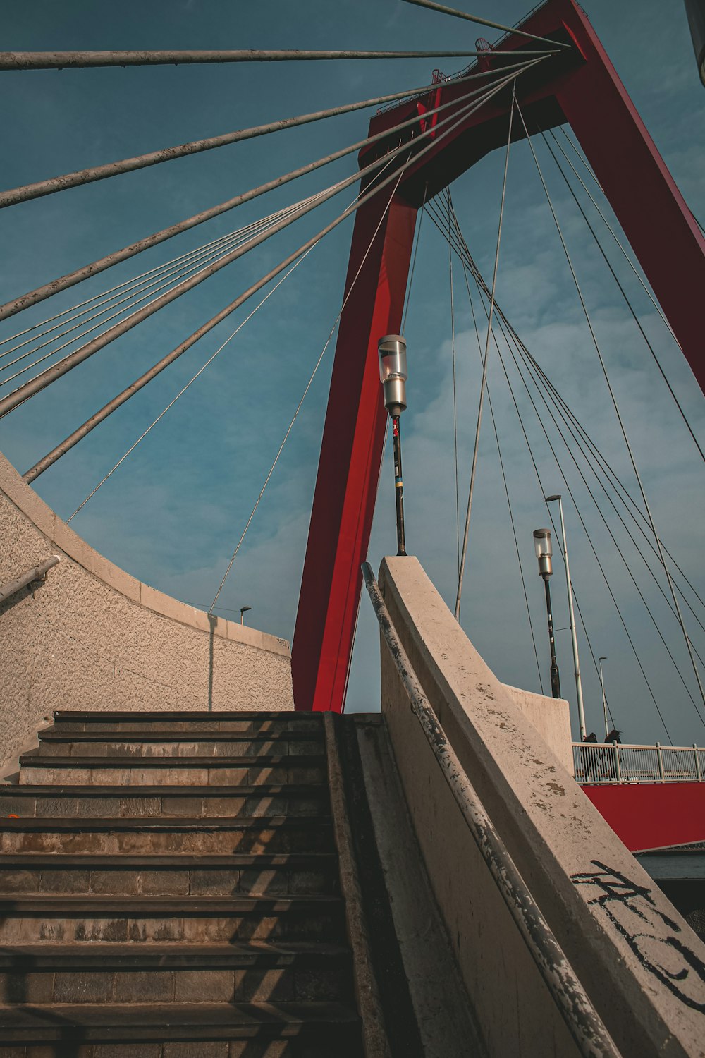 a bridge with a red railing
