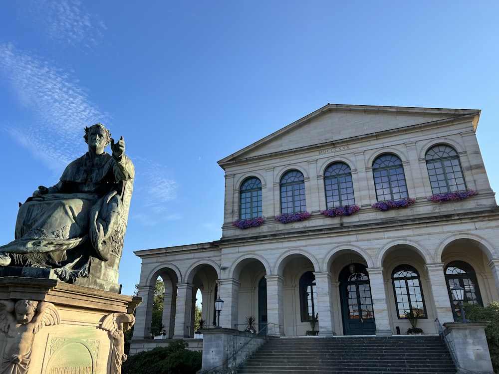 a statue in front of a building