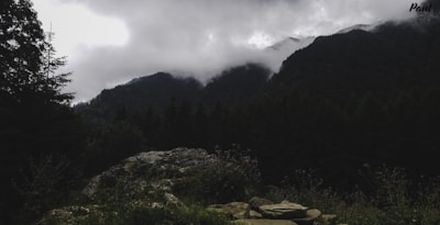 Scenic view from the cabin porch showing misty mountain peaks.