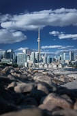 a city skyline with a tall pointy tower