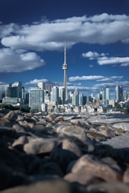 a city skyline with a tall pointy tower