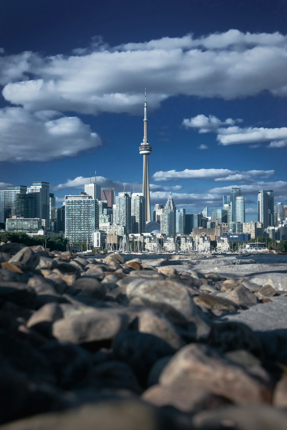 a city skyline with a tall pointy tower