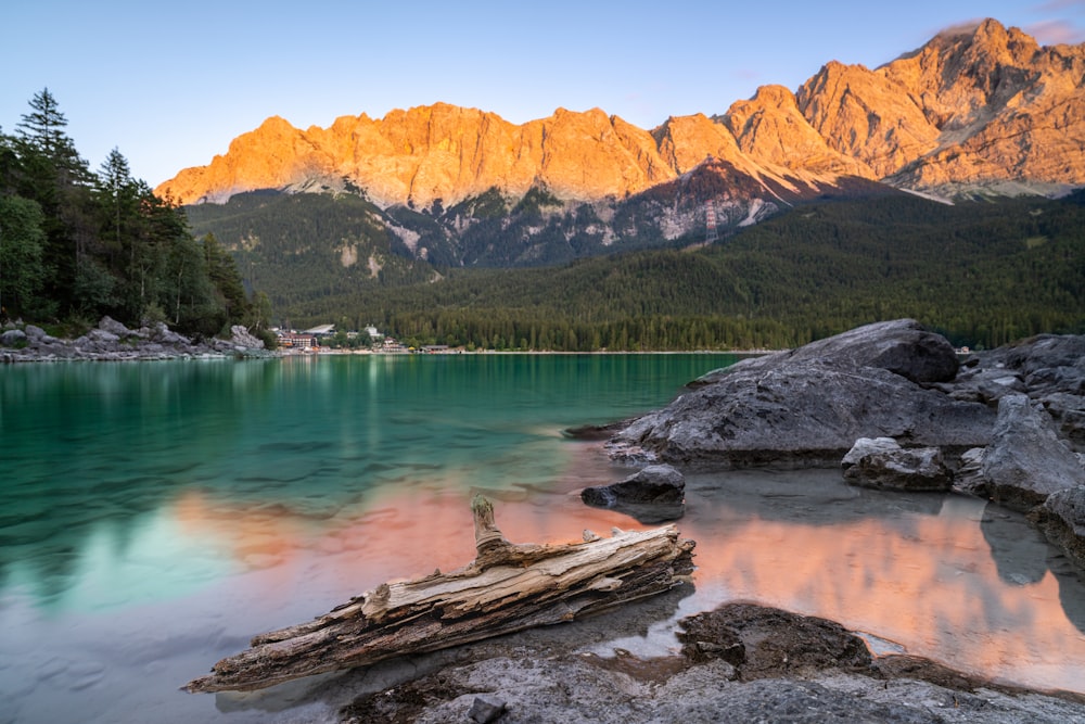 a lake with mountains in the background