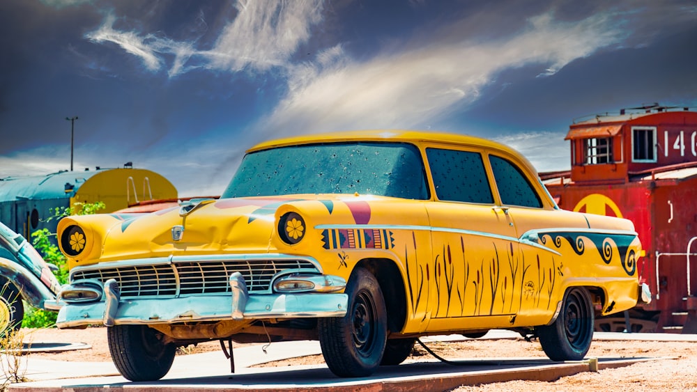 a yellow car with a trailer