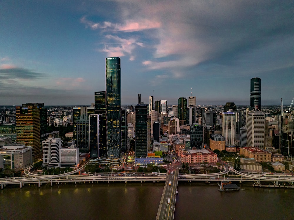 a city skyline with a river