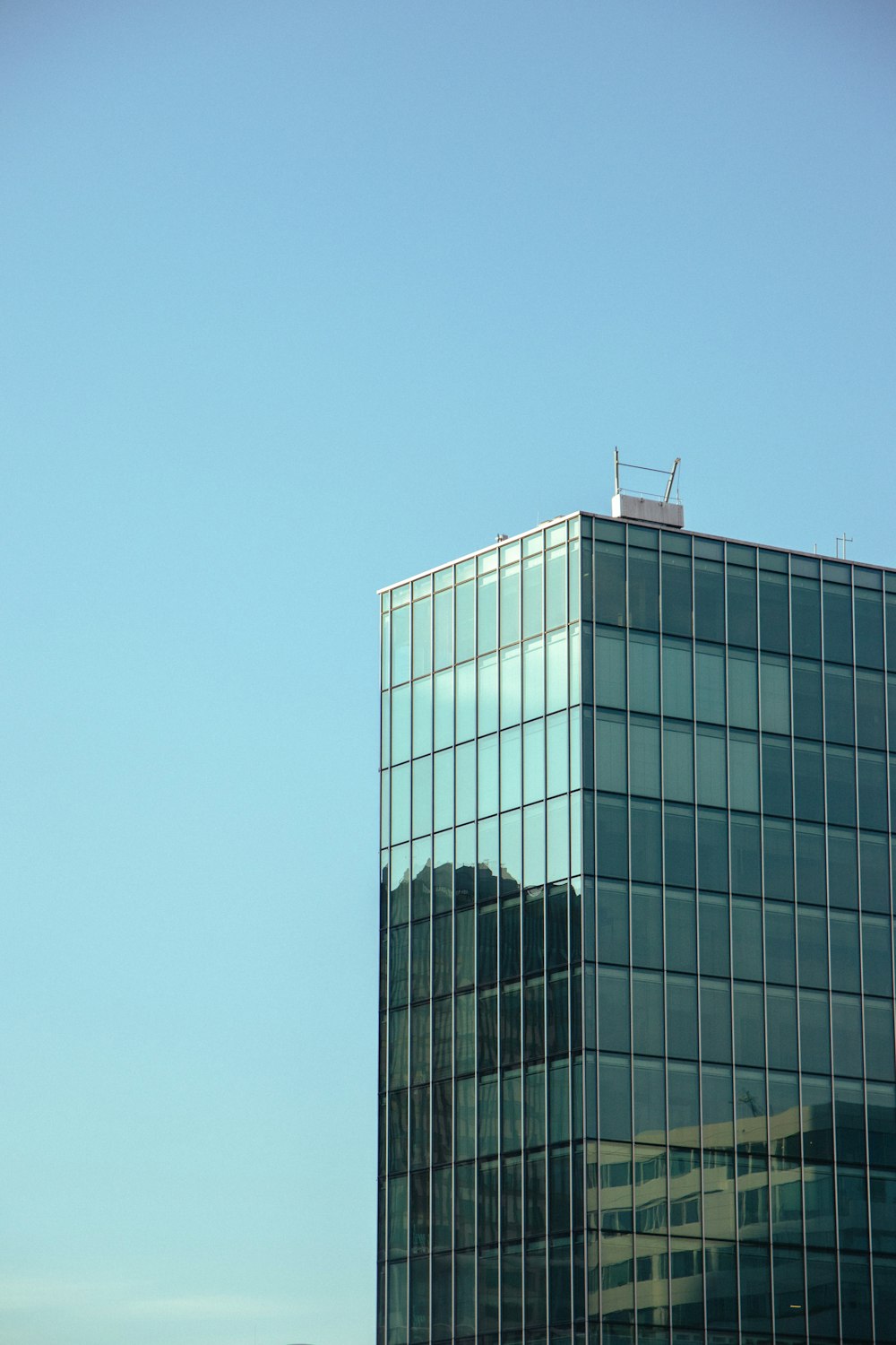 a tall building with a blue sky
