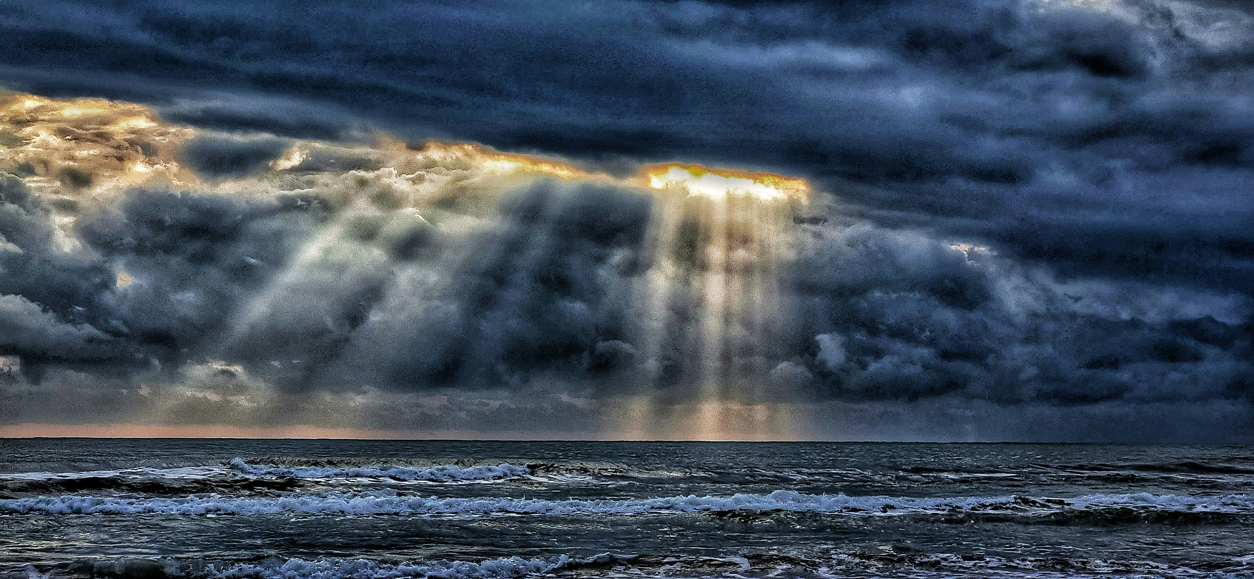 a large tornado over the ocean
