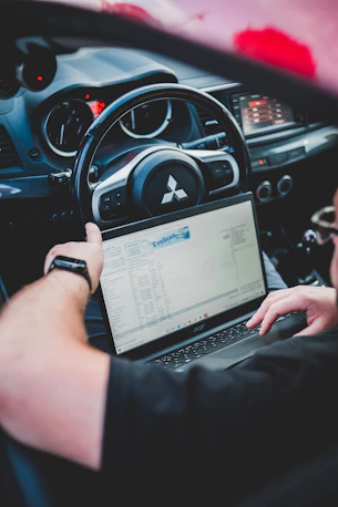 a person holding a laptop