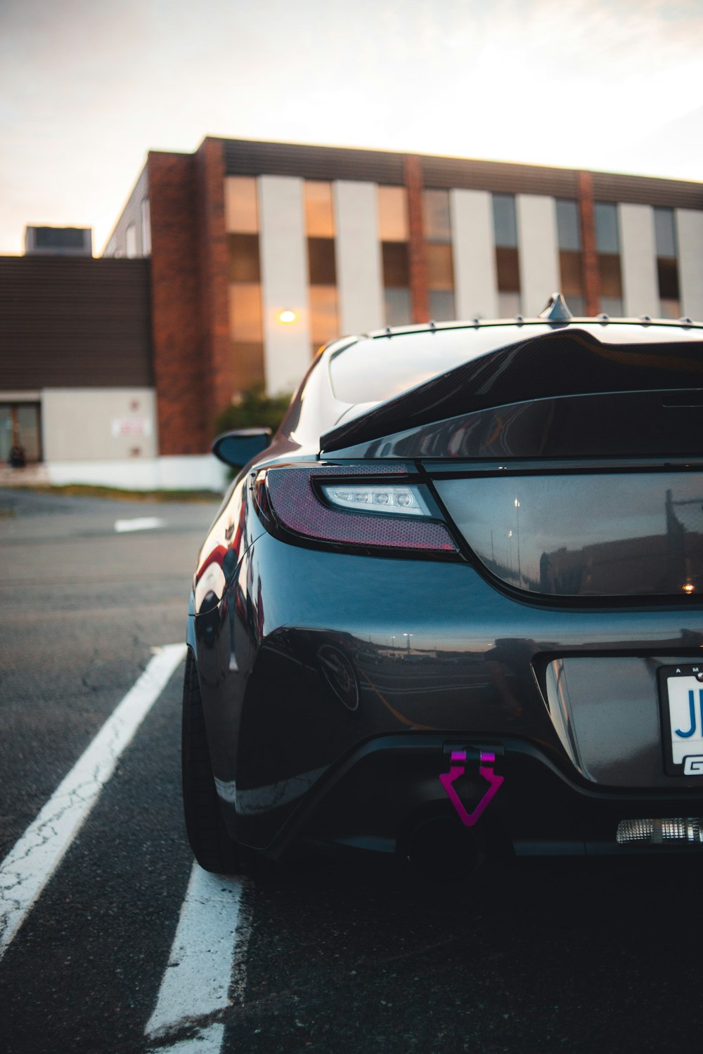 a black car parked in a parking lot