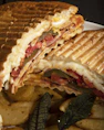 a sandwich with meat and vegetables