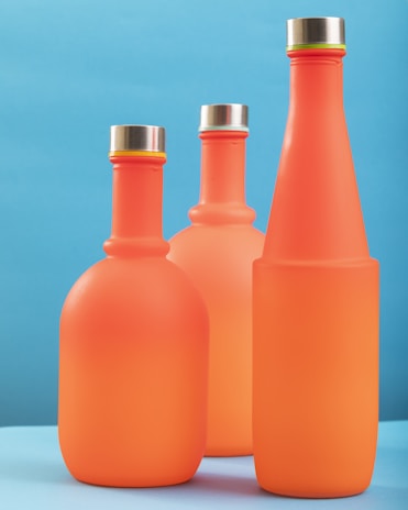 An artistic arrangement of the lubricant bottles in various sizes.
