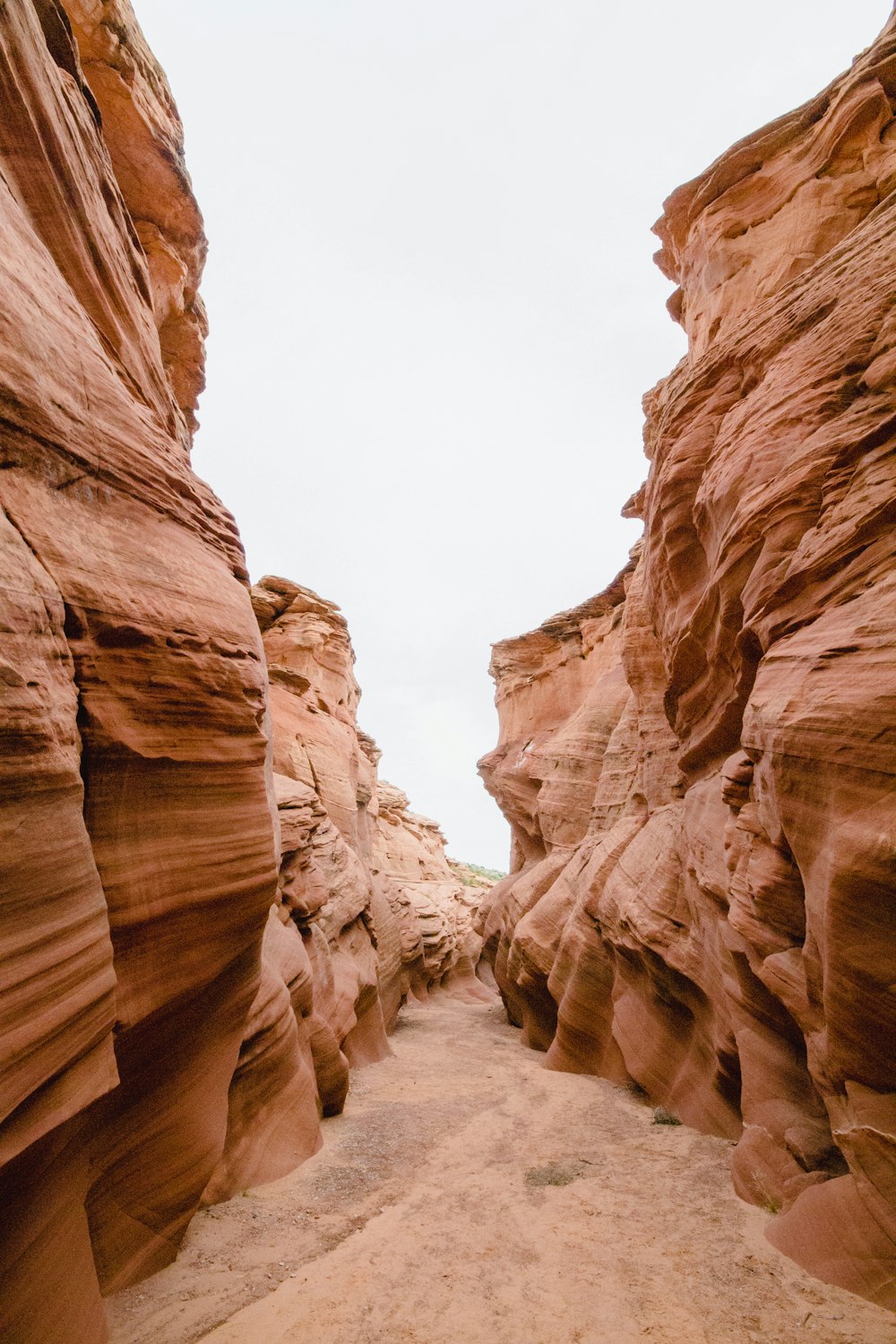 a rocky canyon with a dirt road