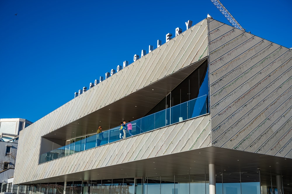 a building with people walking on the stairs