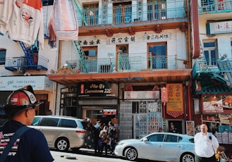 a street with cars and people