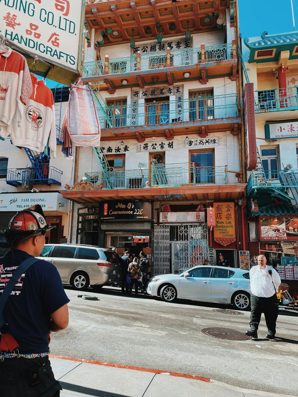 a street with cars and people