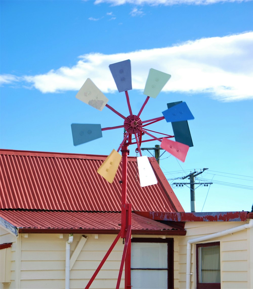 a windmill with a red roof