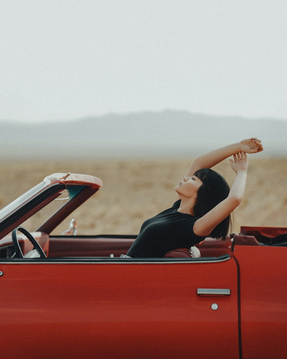 a person lying on a car