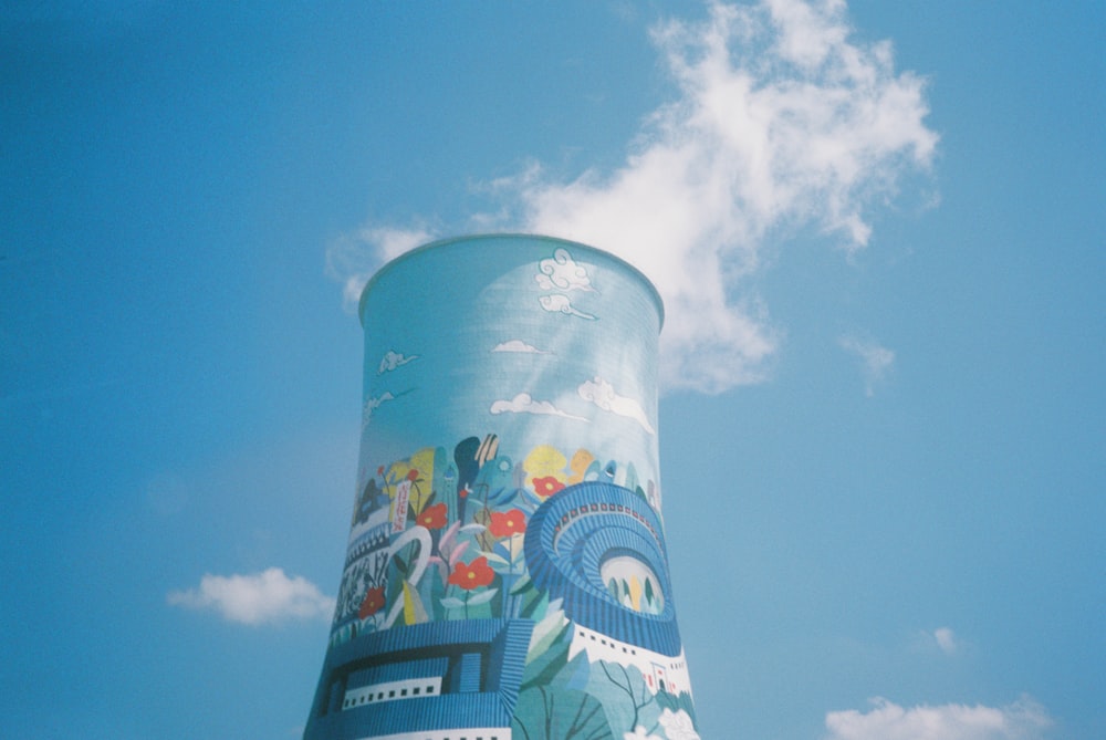 a large glass globe with a blue sky and clouds