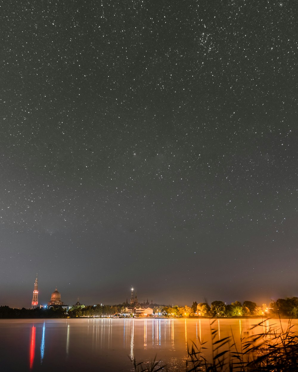 a body of water with a city in the background