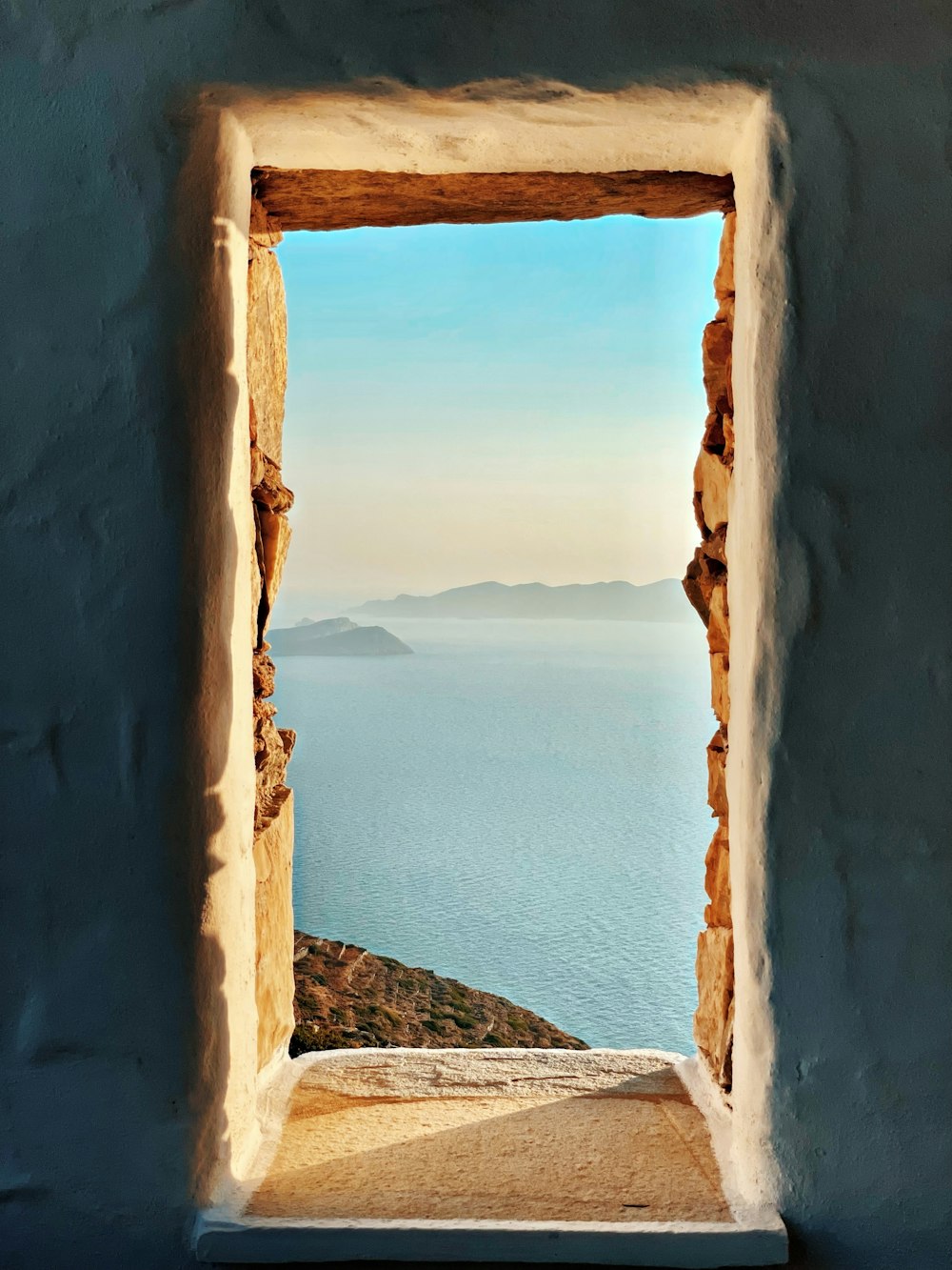 a window looking out to the ocean