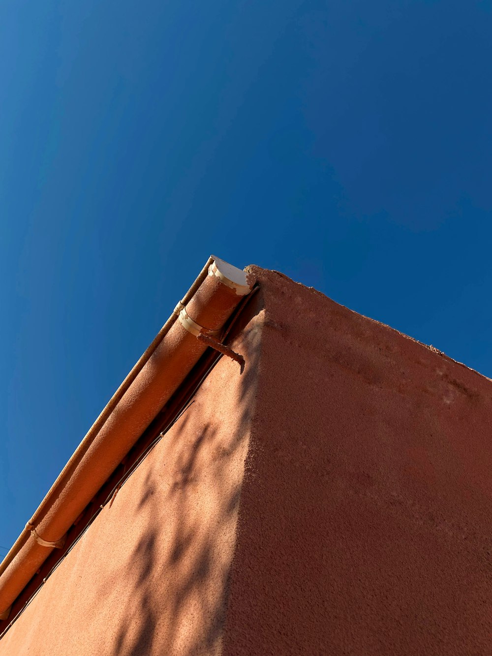 a sand dune with a blue sky