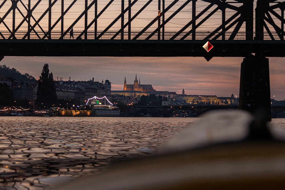 a bridge over a river with boats