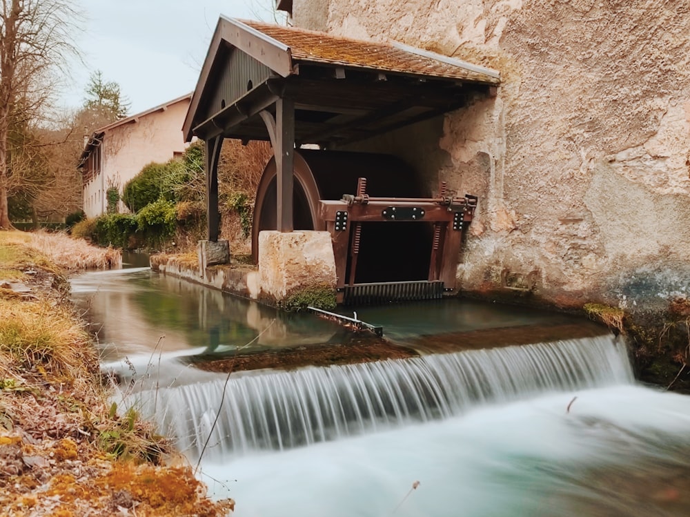 a water fountain in a stone building