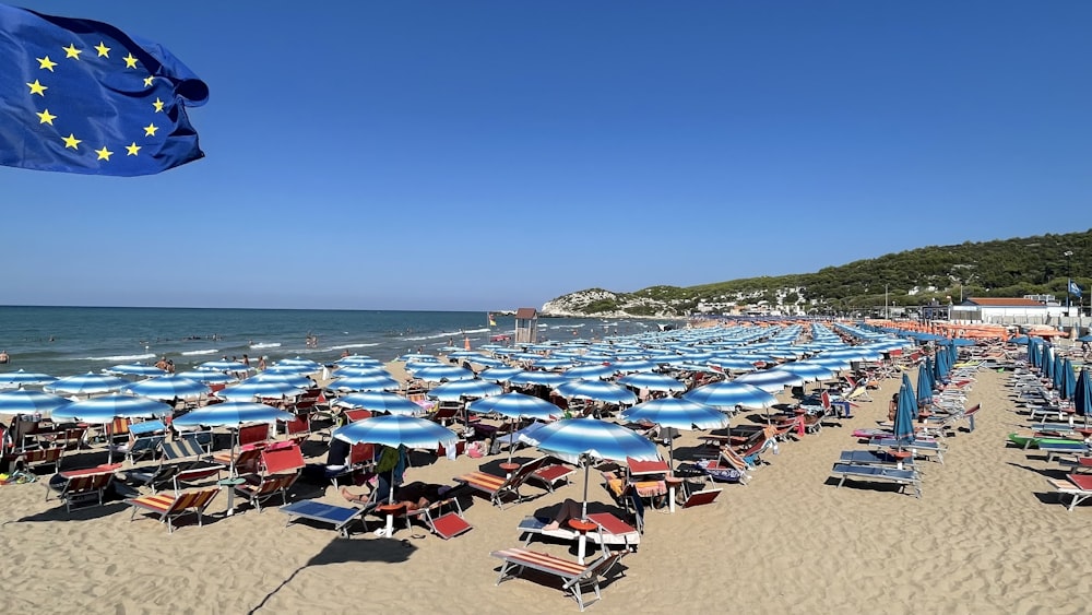 a beach is filled with umbrellas