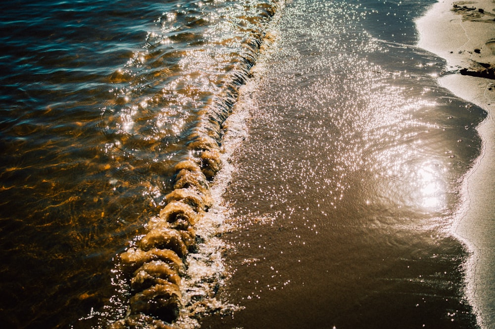 a beach with rocks and water