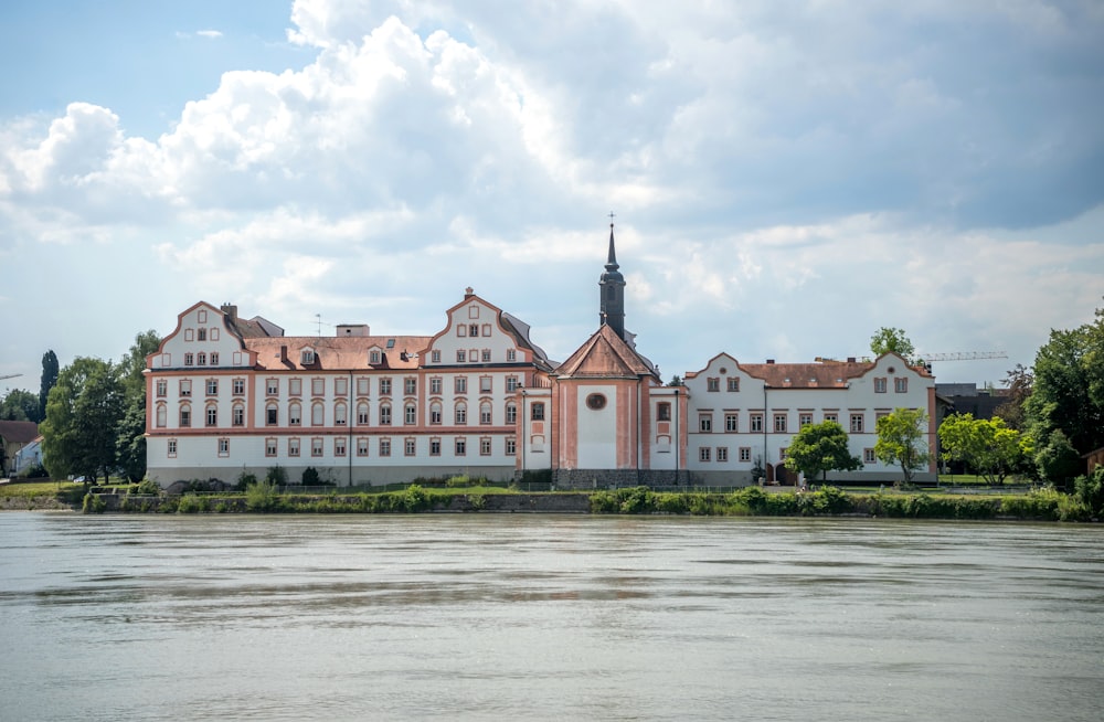 a large building with a body of water in front of it