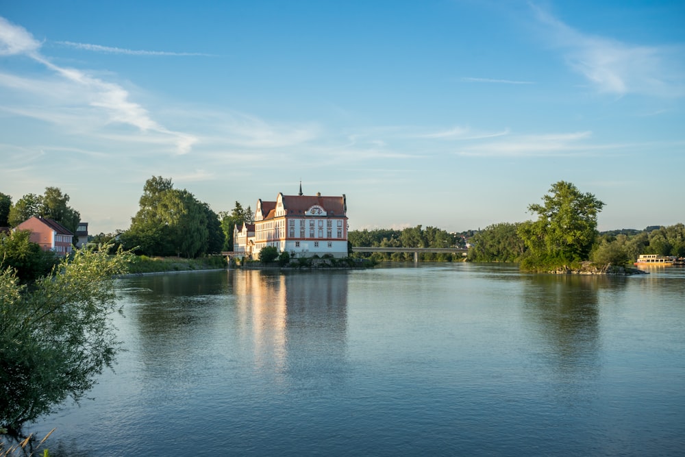 a body of water with a building in the background