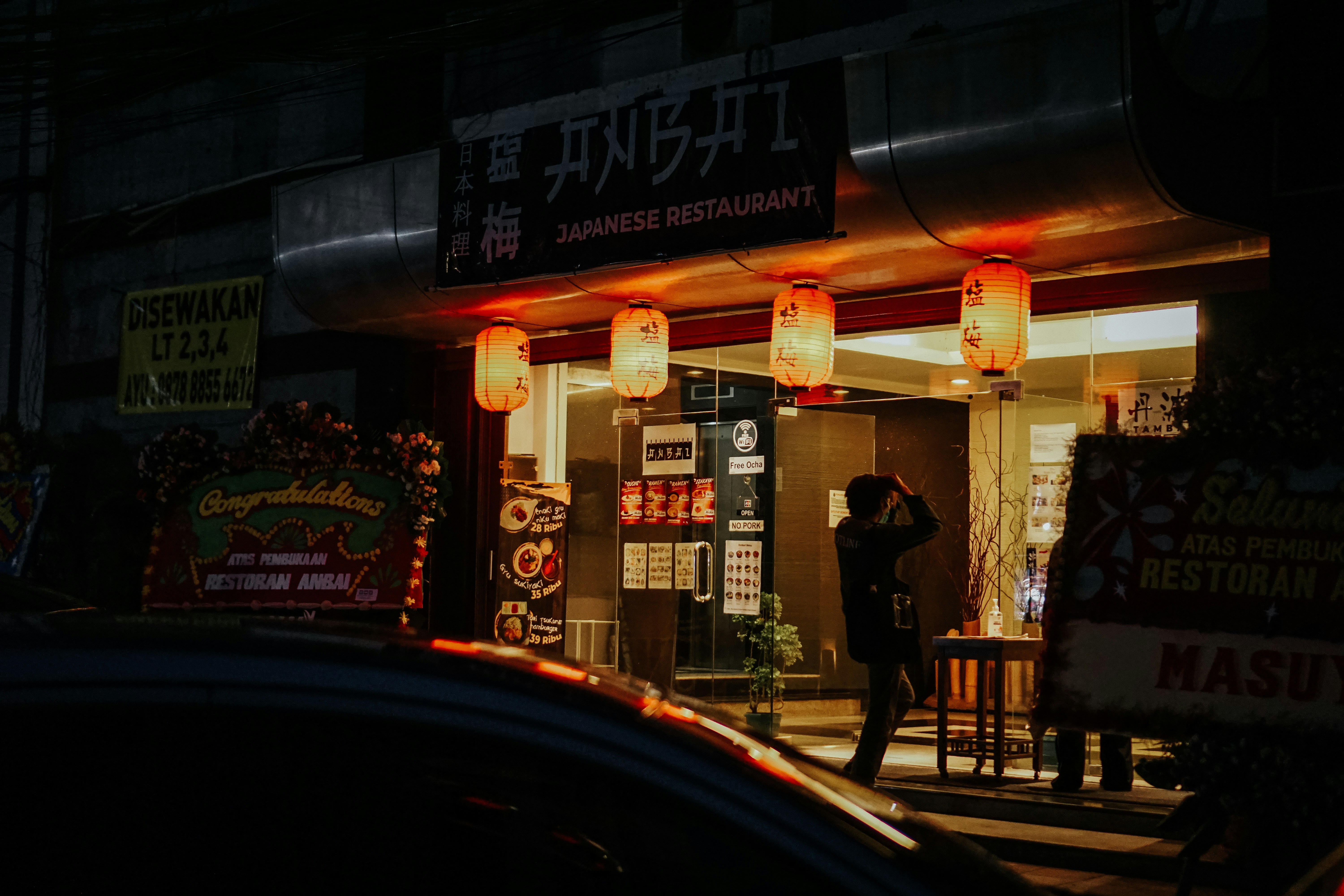 a person walking down a sidewalk, Before We Closed