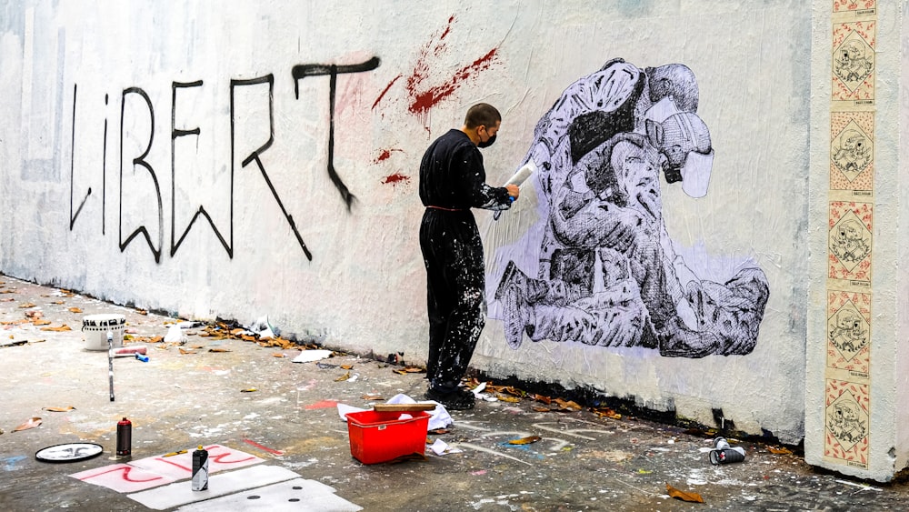 a man painting a wall