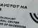 A portion of a building wall featuring black text in both Cyrillic and English. The text reads 'Holocaust Memorial Center for the Jews of Macedonia.' The wall is light gray and textured, and there is a partial image of a Menorah symbol to the right.