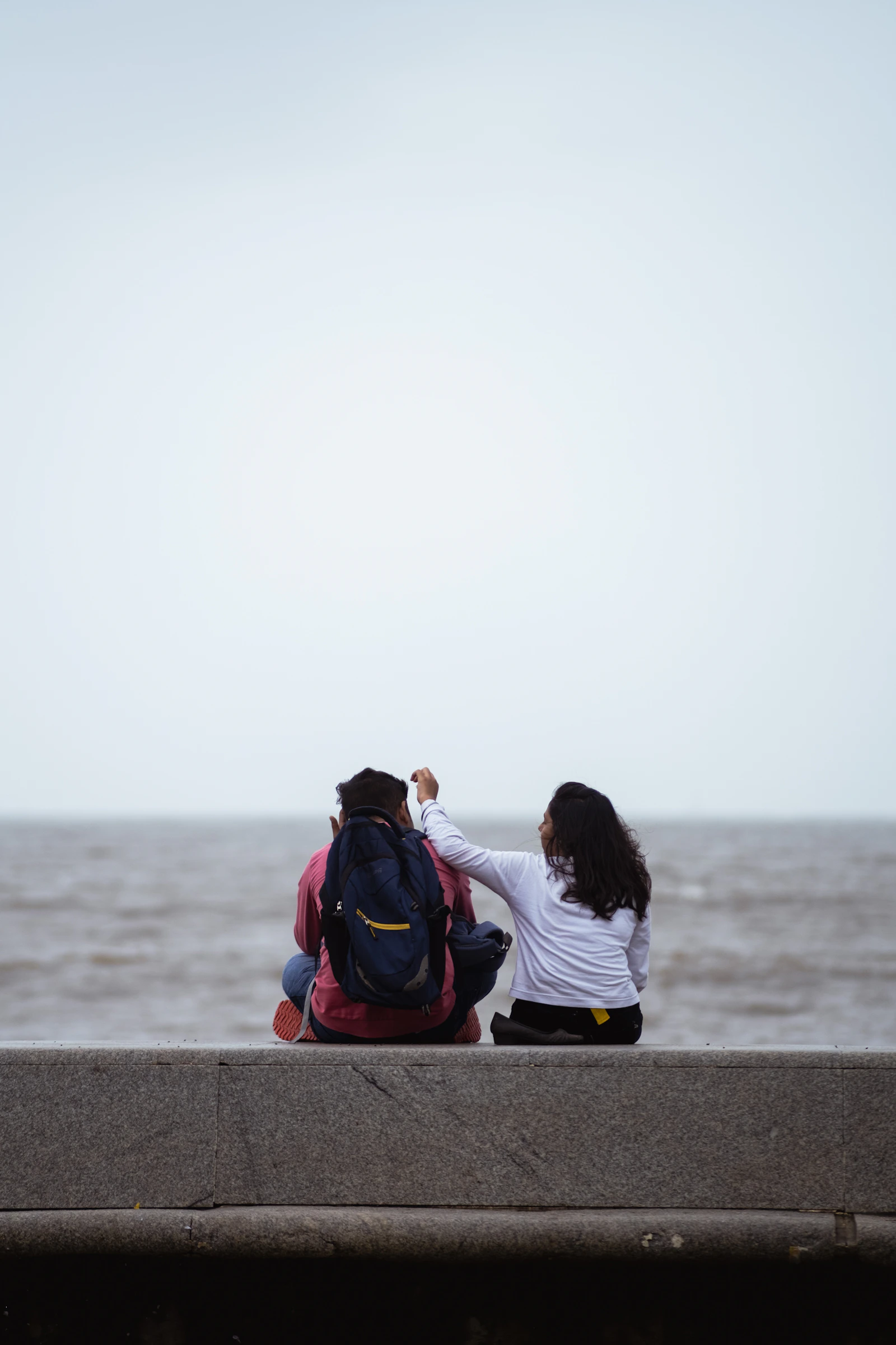Couple sitting near Marine Drive Mumbai