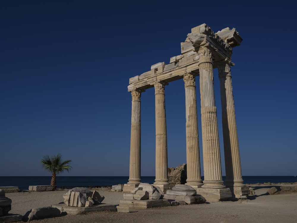 a group of pillars in a desert