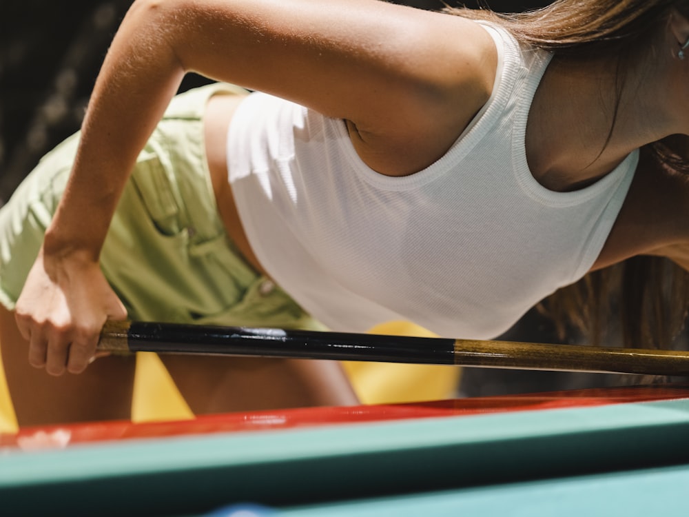 a person in a white tank top