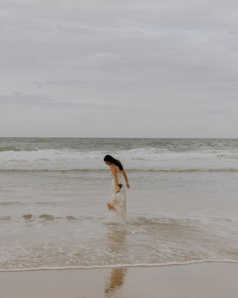 a dog running on the beach