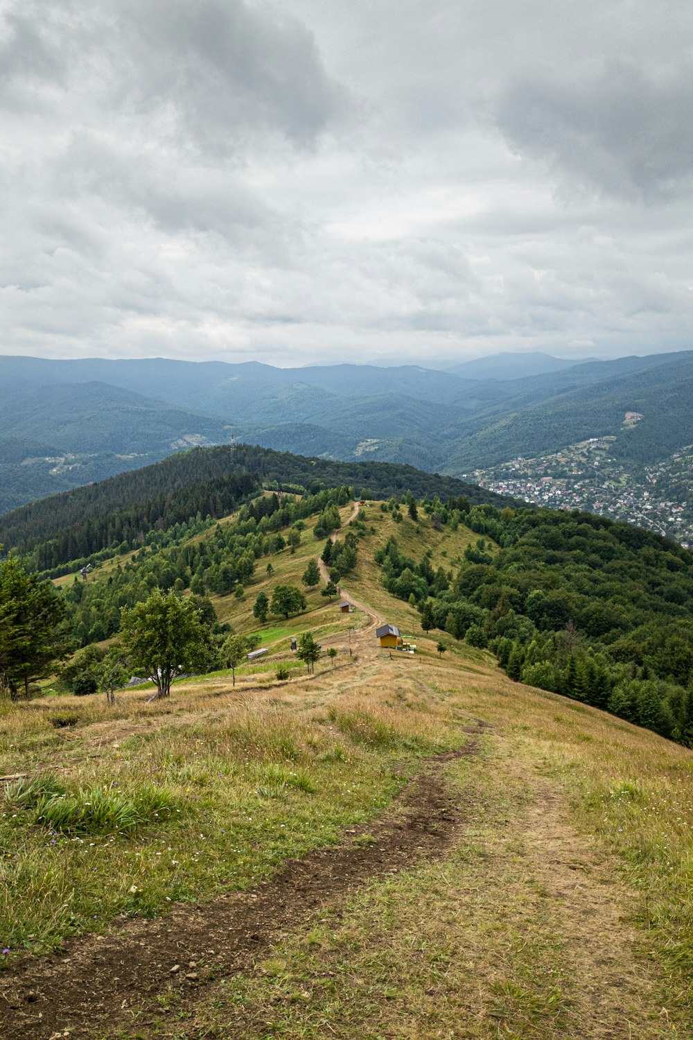 a dirt road in a valley