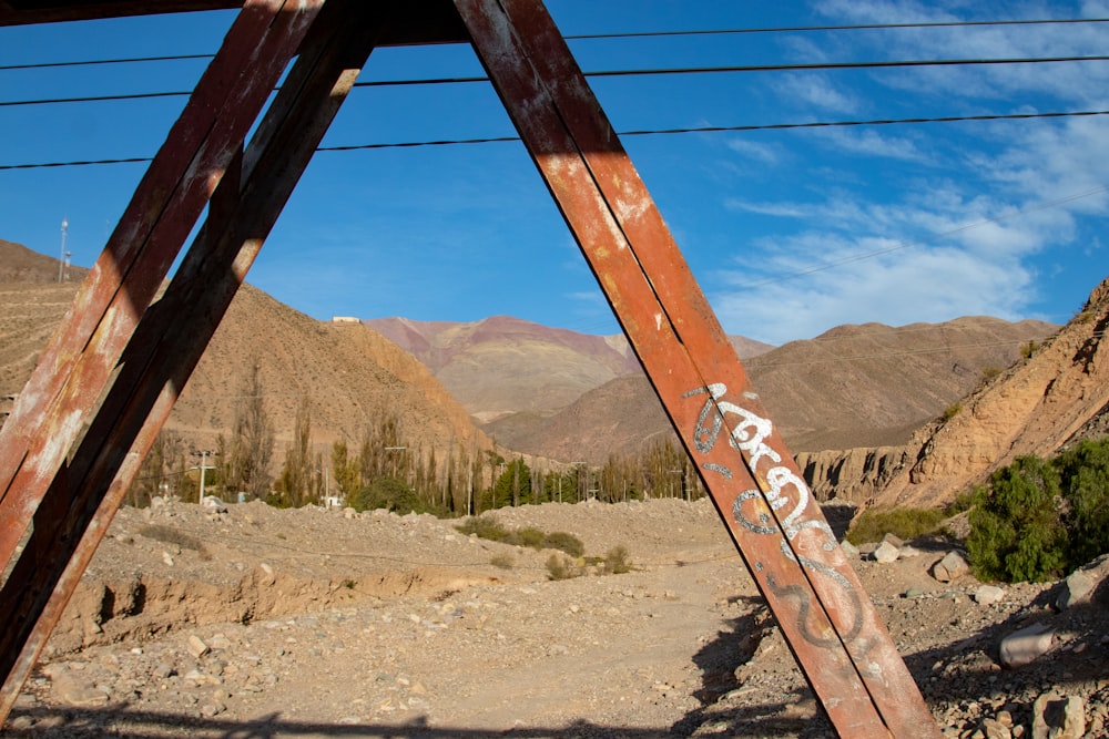 a bridge over a dirt road