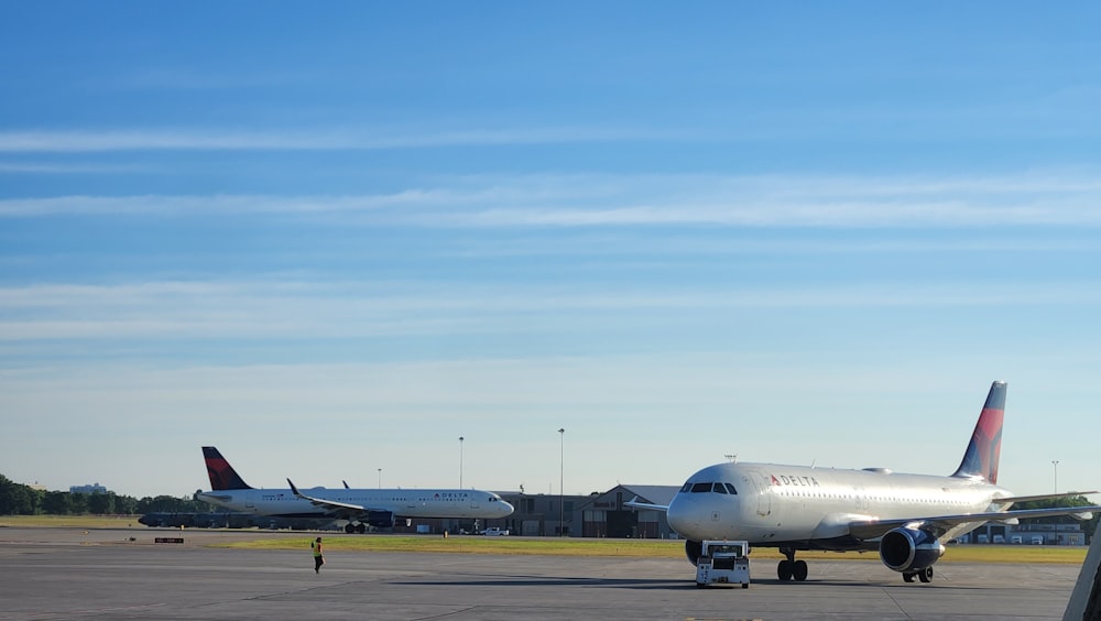 a couple of airplanes at an airport