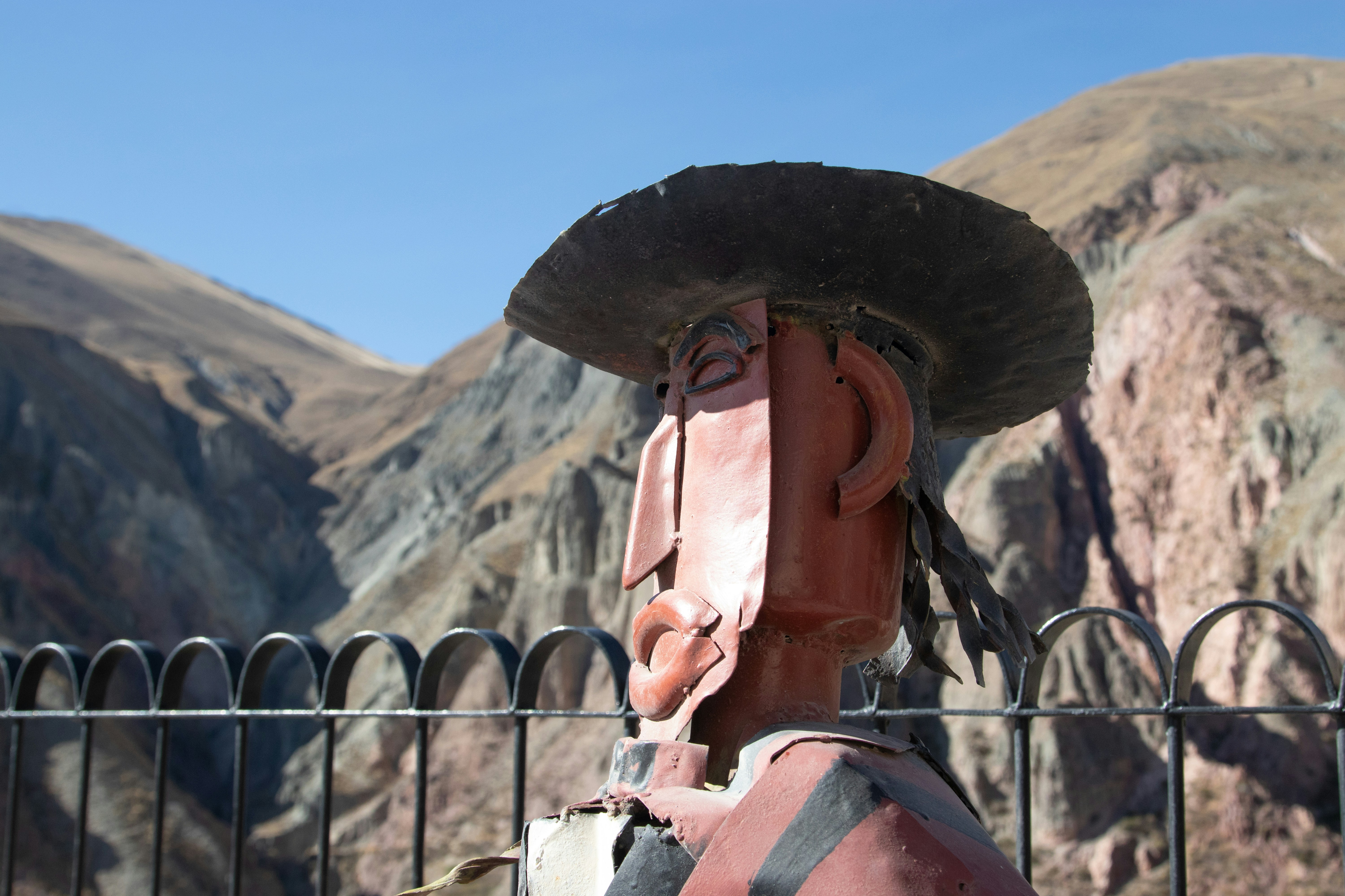 a person wearing a hat and holding a pipe