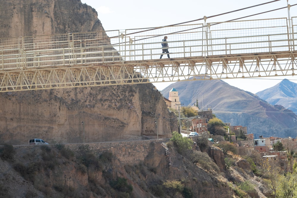 a person walking on a bridge