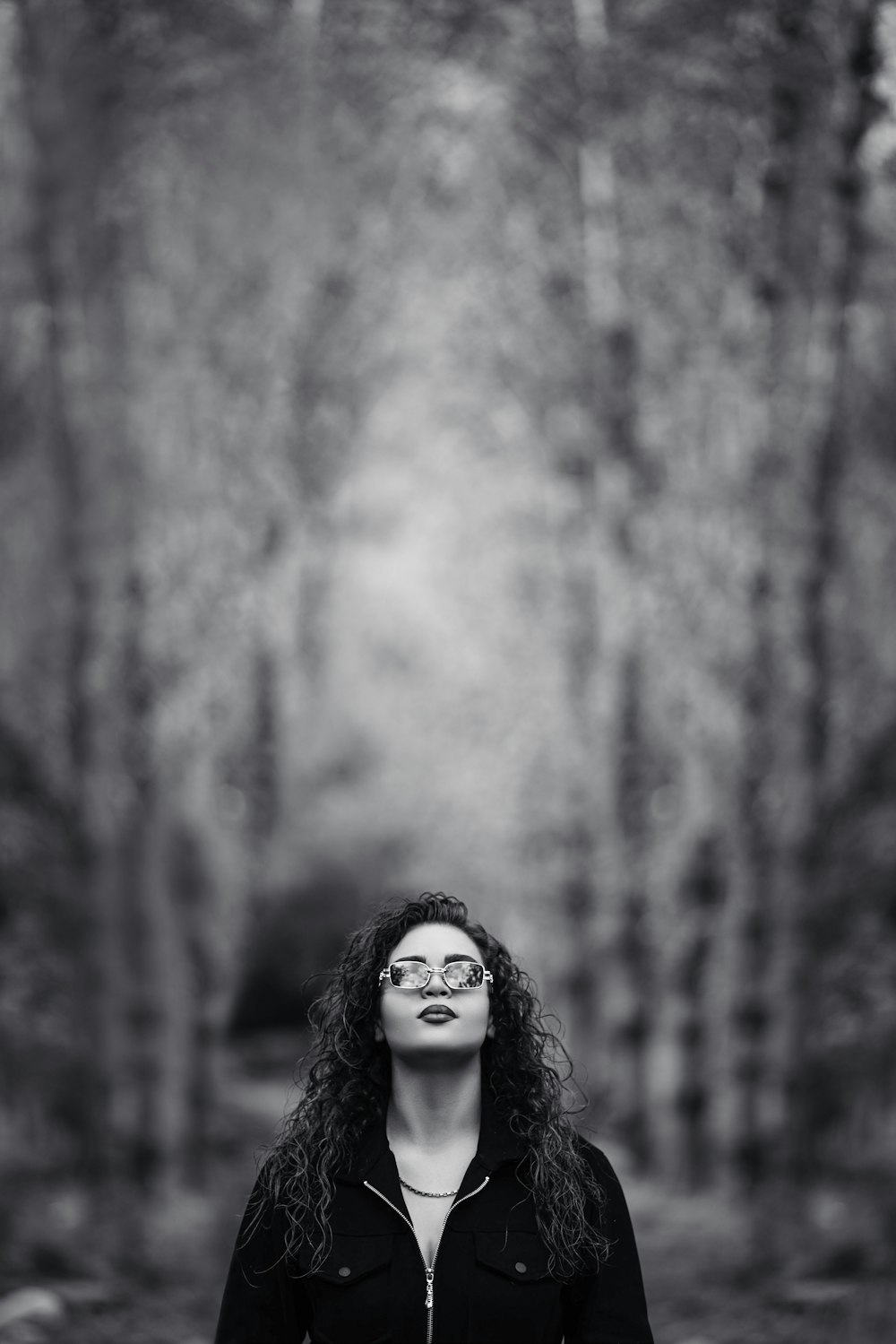 a woman with long hair and glasses