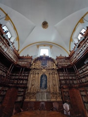 An inviting library filled with religious texts and books.