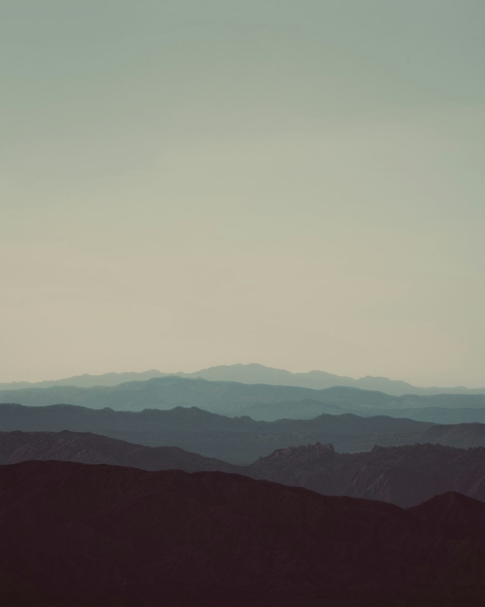 a landscape with hills in the back